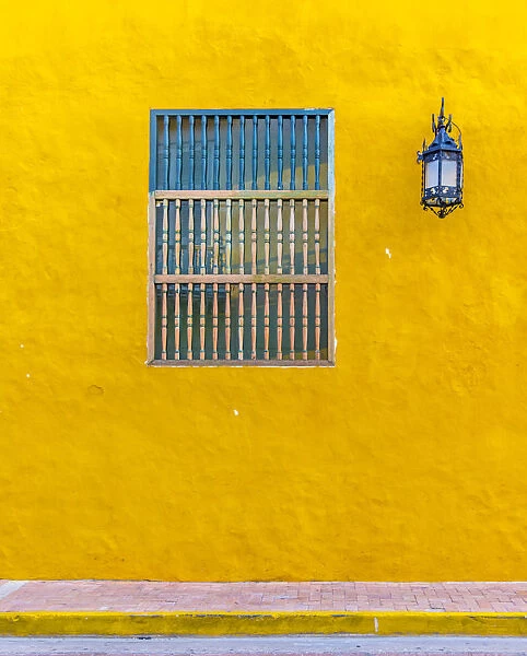 The facade of a colourful traditional building in the old town in Cartagena de Indias