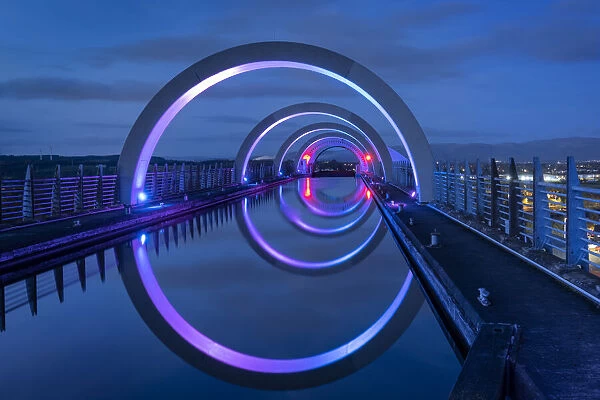 The Falkirk Wheel on the Union Canal illuminated at night, Falkirk, Stirlingshire, Scotland, United Kingdom, Europe