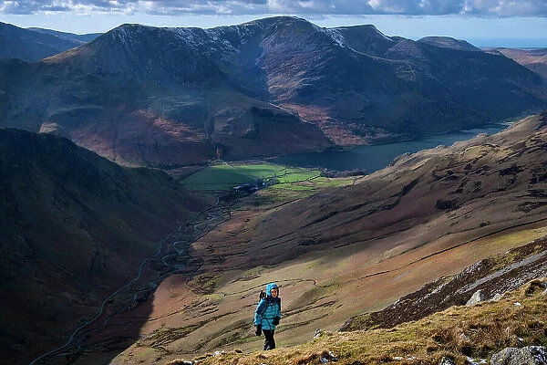 Female walker on Dale Head above Honister Pass and Buttermere Valley, Lake District National Park, UNESCO World Heritage Site, Cumbria, England, United Kingdom, Europe