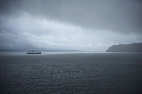 A ferry boat moves through stormy weather from Vashon Island to West Seattle