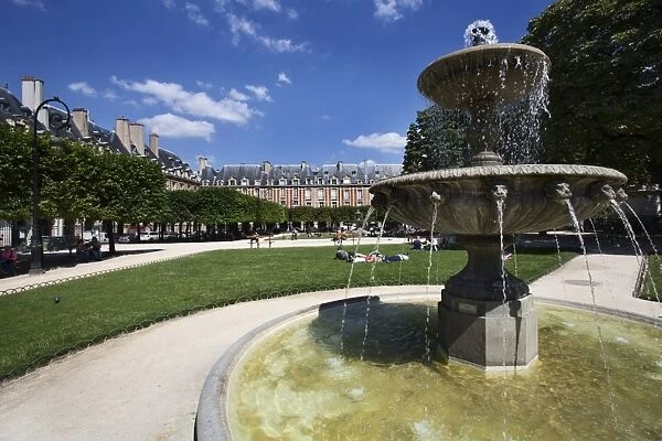 Fountain in Place des Vosges in The Marais, Paris, France, Europe
