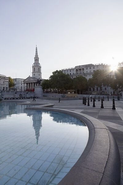 Fountain with statue of George IV and St. Martin-in-the-Fields church, Trafalgar Square, London, England, United Kingdom, Europe