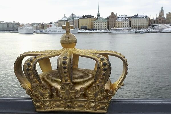 A gilded Swedish crown on the Skeppsholm Bridge (Skeppsholmsbron) in Stockholm, Sweden