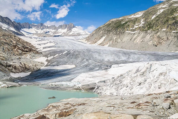 Glacial lake and Rhone Glacier partially protected by blankets to slow melting, Gletsch