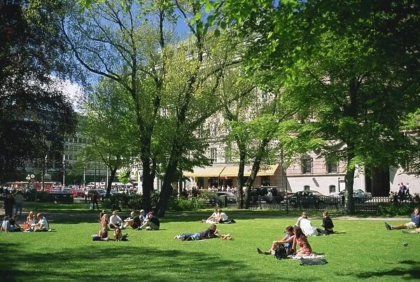 Groups of people in Berzelii Park in the city centre of Stockholm