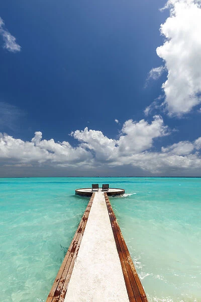 Jetty and chairs overlooking sea, The Maldives, Indian Ocean, Asia