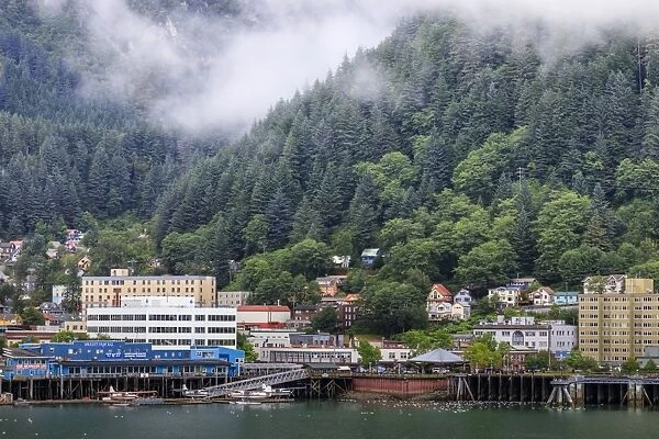 Juneau, State Capital, view from the sea, mist clears over downtown buildings, mountains