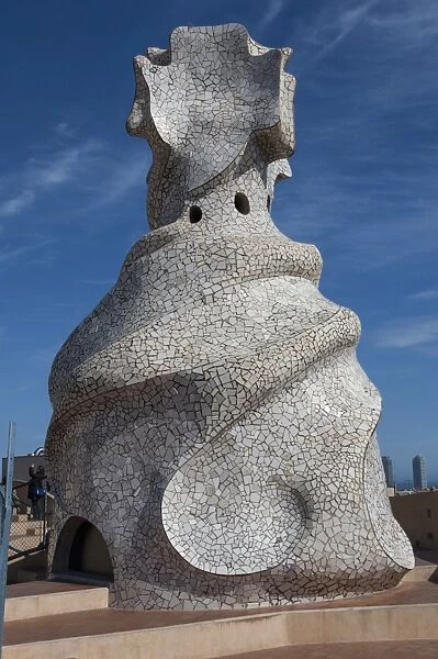 Large chimney inlaid with random cut white glazed tile, roof of La Pedrera (Casa Mila), an apartment house designed by Antonio Gaudi, UNESCO World Heritage Site, Passeig de Gracia, Barcelona, Catalunya, Spain, Europe