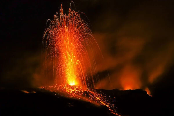 Lava bombs erupt from one of many vents on volcano, active for at least 2000 years, Stromboli, Aeolian Islands, UNESCO World Heritage Site, Sicily, Italy, Mediterranean, Europe