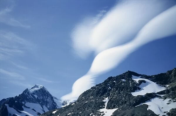 Lenticular clouds over landscape of mountains in South Georgia