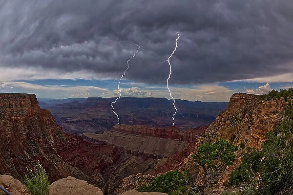 Lightning striking inside the Grand Canyon during the 2023 Arizona Monsoon season, viewed from No Name Overlook between Pinal Point on the left and Lipan Point on the right, Grand Canyon National Park, UNESCO World Heritage Site, Arizona