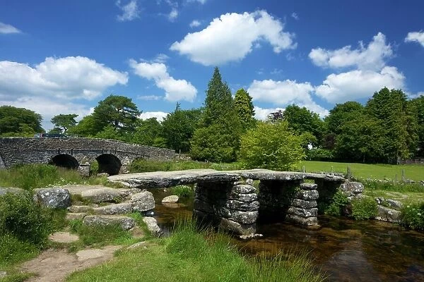 Medieval clapper bridge made of four massive granite slabs crossing the East Dart River