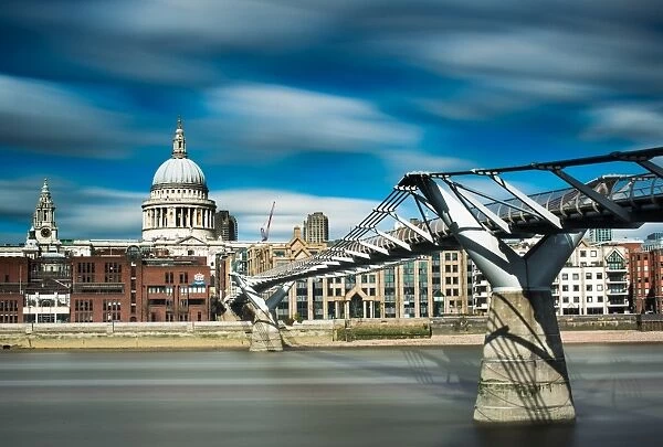Millennium Bridge and St. Pauls Cathedral across the River Thames, London, England