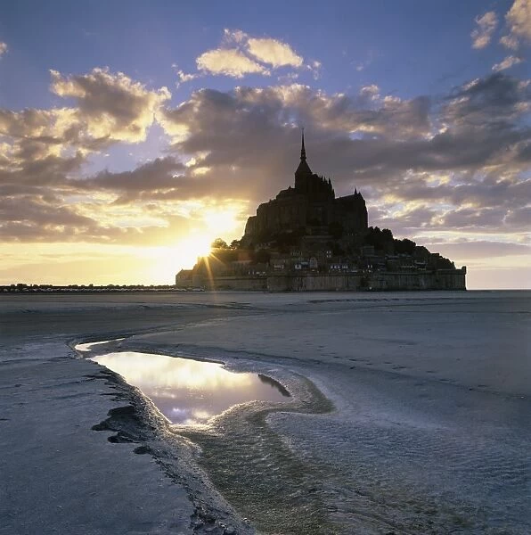 Mont Saint-Michel from the tidal flats at sunset, Mont Saint-Michel, UNESCO World Heritage Site, Normandy, France, Europe