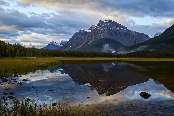 Mountain reflected in Waterfowl Lake at sunrise, Banff National Park, UNESCO World Heritage Site, Alberta, Rocky Mountains, Canada, North America