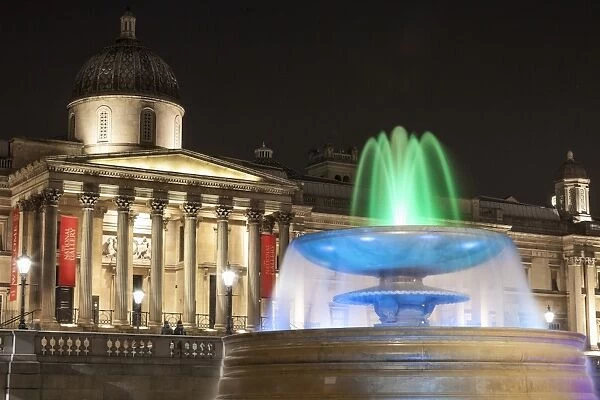 The National Gallery and fountain in Trafalgar Square at night, London, England, United Kingdom, Europe