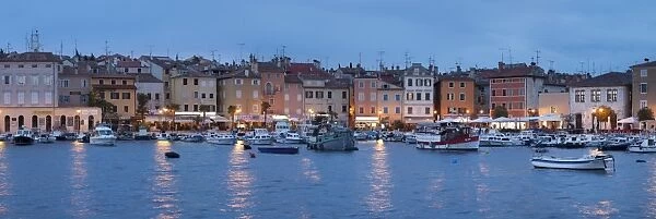 Panoramic image of the waterfront and harbour with ships and boats at dusk, Rovinj, Istria, Croatia, Europe
