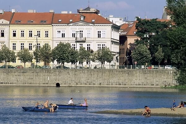 People boating on Vltava River below Smetana embankment, Stare Mesto, Prague