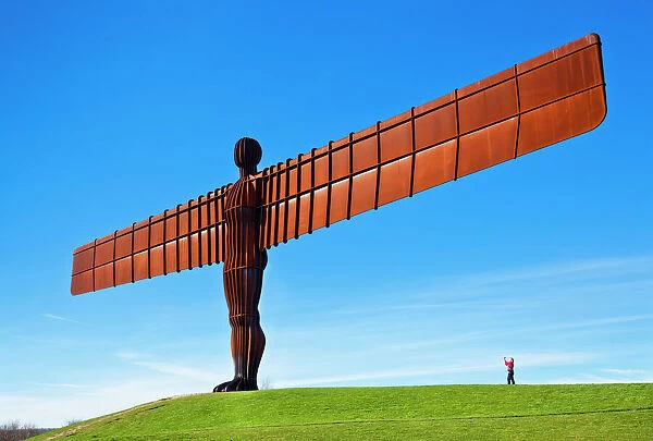 Person photographing the Angel of the North sculpture by Antony Gormley, Gateshead