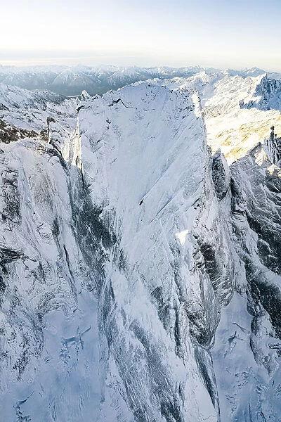 Pizzo Badile covered with snow after a winter blizzard, aerial view, Val Bregaglia