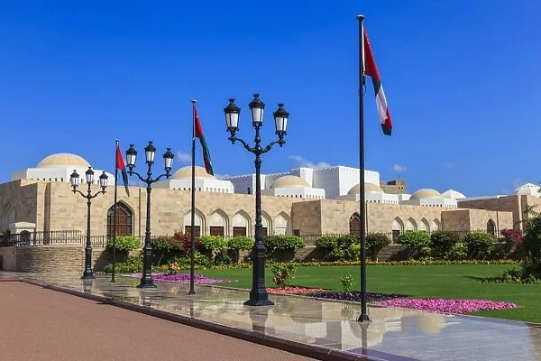 Polished pavements, National Flags, lush lawns and flowers in bloom, Sultans Palace