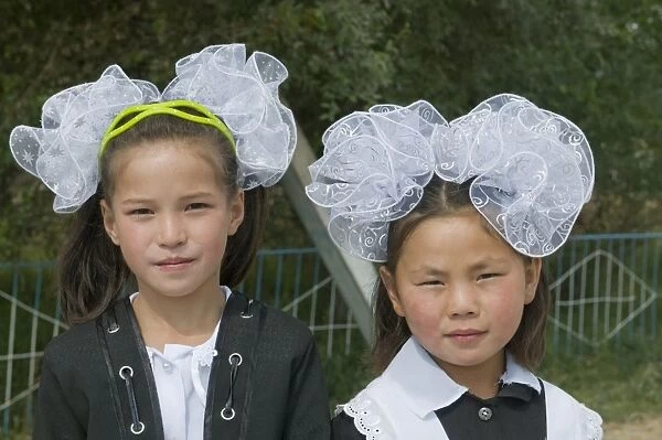 Portrait of girls in traditional clothes, Torugart, Kyrgyzstan, Central Asia, Asia