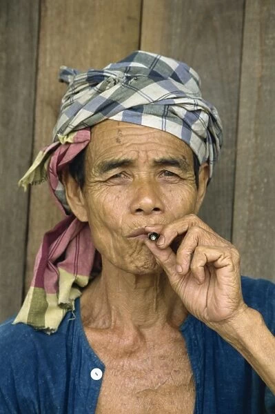 Portrait of refugee smoking