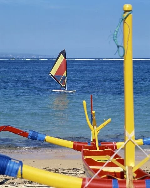 Prahu boat and windsurfer