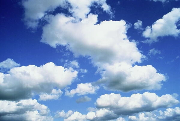 Puffy white clouds in a blue sky in England, United Kingdom, Europe