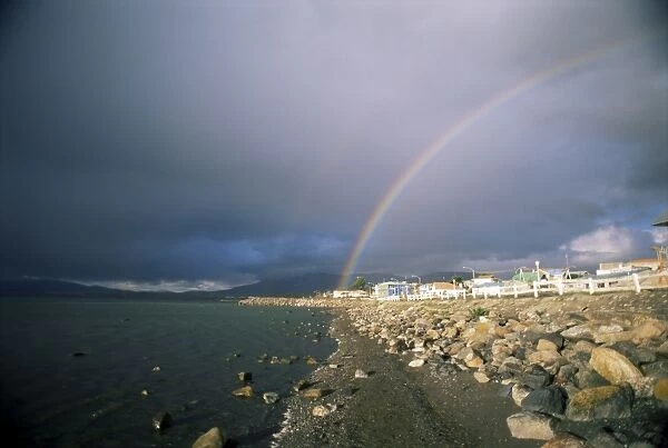 Rainbow over the town of Puerto Natales, Chile, South America