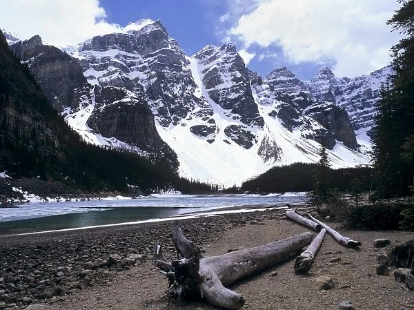 Reduced water level in Moraine Lake following a dry year, and Wenkchemna Mountains