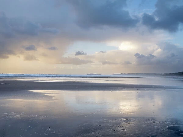Reflections in wet sand at dusk, Rhossili, Gower, South Wales, United Kingdom, Europe
