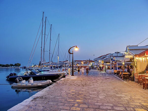 Restaurants at the waterfront at dusk, Port of Pythagoreio, Samos Island, North Aegean, Greek Islands, Greece, Europe