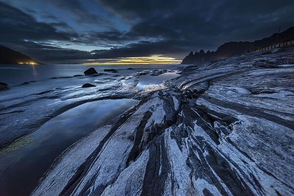 Rock formations and reflection, at dusk, Tungeneset, Senja, Norway, Scandinavia, Europe