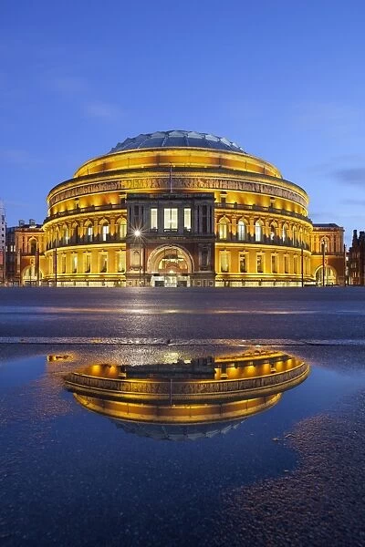 Royal Albert Hall reflected in puddle, London, England, United Kingdom, Europe