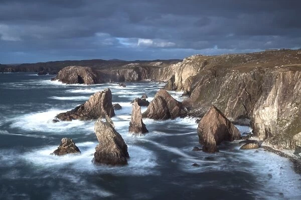 Rugged coastline being pounded by waves on the West coast of Lewis at Mangersta, Isle of Lewis, Outer Hebrides, Scotland, United Kingdom, Europe