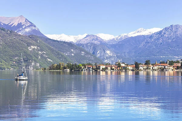 Sailboat on the lake in front Mandello del Lario, Province of Lecco, Lake Como, Italian Lakes