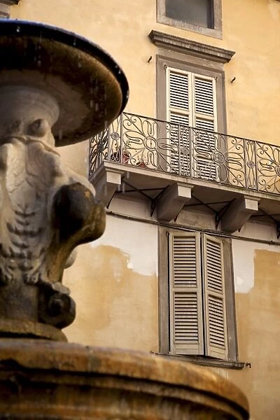 Shuttered windows and fountain, Bergamo, Lombardy, Italy, Europe