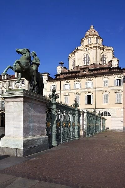 Statue and railings in Piazza Reale with San Lorenzo Church, Turin, Piedmont, Italy, Europe