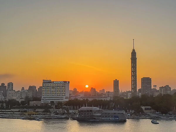 Sunset over the Cairo Tower from the east side of the Nile River, Cairo, Egypt, North Africa, Africa