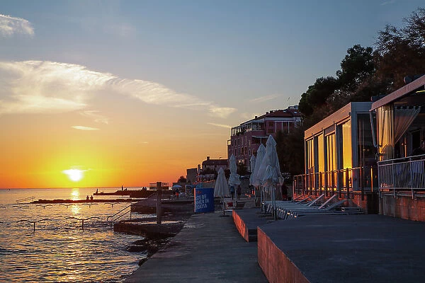 Sunset, sea view, restaurants on the right, Old Town, Novigrad, Croatia, Europe