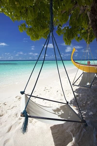 Swing and traditional boat on tropical beach, Maldives, Indian Ocean, Asia