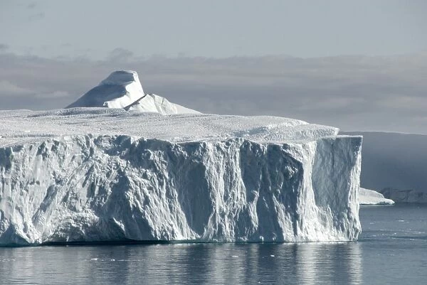 Tabular iceberg emerging from Kangia Ice Fjord, next to Ilulissat, Disko Bay