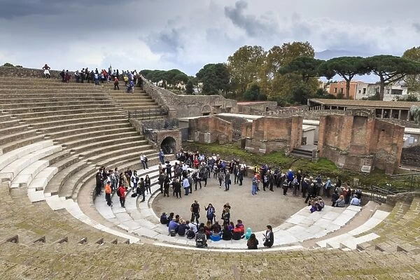 Tour groups in the Large (Grand) Theatre, Roman ruins of Pompeii, UNESCO World Heritage Site