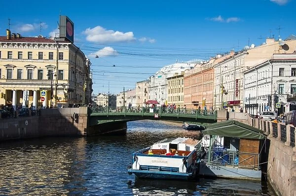 Tourist boat on a water channel in the center of St. Petersburg, Russia, Europe