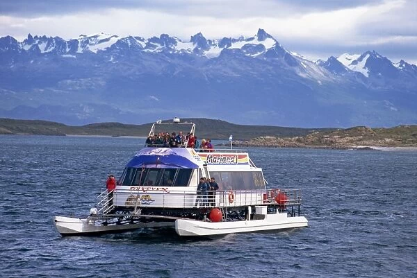 Tourists on a catamaran on a wildlife tour in the Beagle Channel off Argentina
