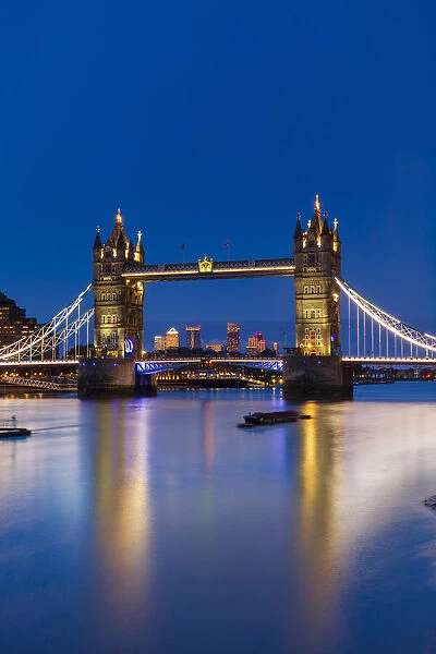 Tower Bridge at sunset with Canary Wharf skyline in background, London, England, United Kingdom, Europe