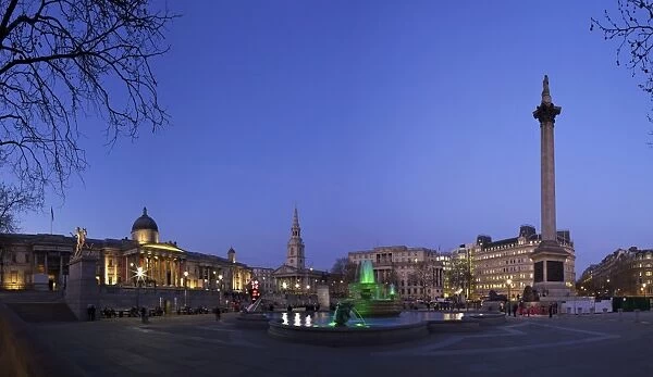 Trafalgar Square at dusk with Nelsons Column, St. Martin in the Fields and the National Gallery, London, England, United Kingdom, Europe