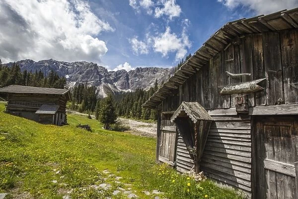 Typical wooden houses in the Funes Valley in the Dolomites by the Passo delle Erbe, South Tyrol, Italy, Europe