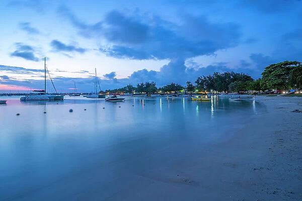 View of boats on the water in Grand Bay at dusk, Mauritius, Indian Ocean, Africa